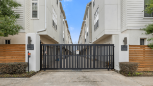 This image shows a gated townhome community in Houston's Cottage Grove neighborhood. The community is close to Houston's major employment centers, shopping, and restaurants. The townhomes are spacious and well-appointed, and the community offers a variety of amenities, including access to the White Oak Hike and Bike Trail.